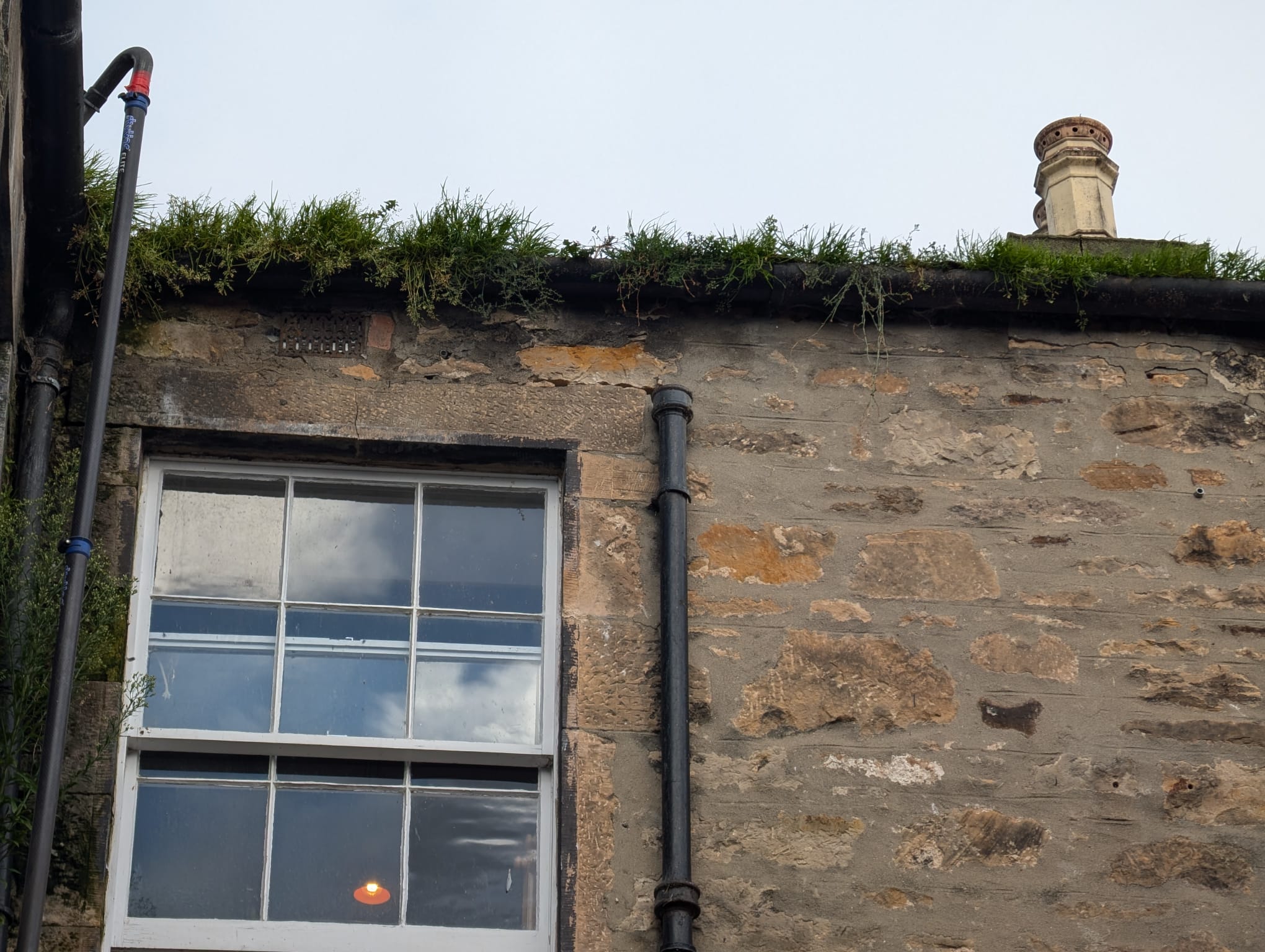 Traditional Scottish stone building gutter maintenance and cleaning